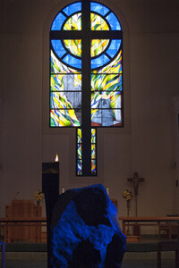 Stained glass window and baptismal font