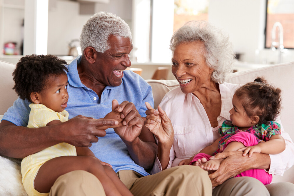 african-american-grandparents-happily-engaged-with-their-two-young-grandchildren