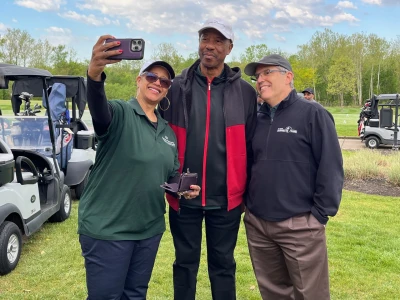 The Rev. Johnsie Cogman, left, takes a selfie with her husband, Billy (center) and Paul Eichelberger.